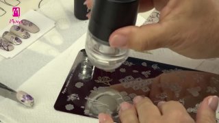 Floral nail art prepared with layer stamping