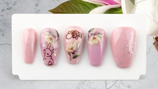 Easter nail art with bunny, flower and magic flake