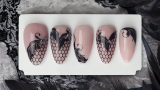 Soft nude base with decorative black motif